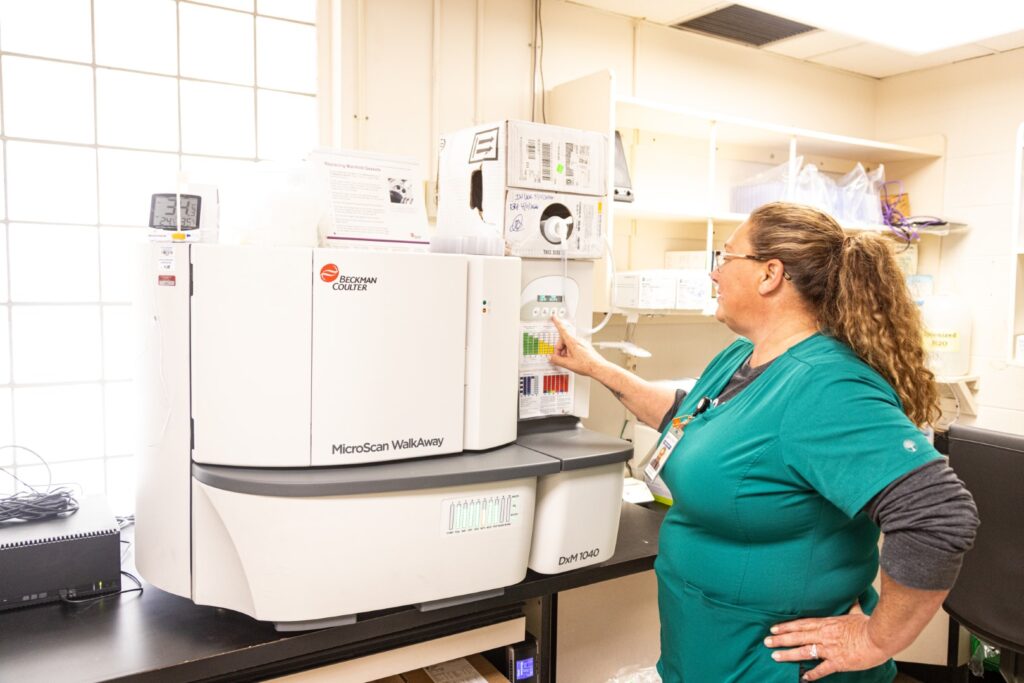 Healthcare staff working with laboratory equipment